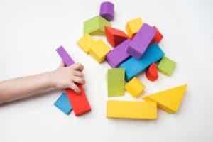 Multi-colored toy blocks on a white background